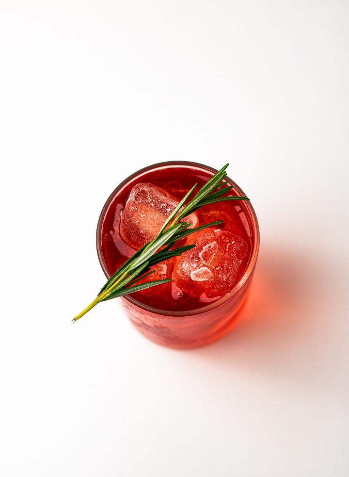 red liquid in clear glass jar